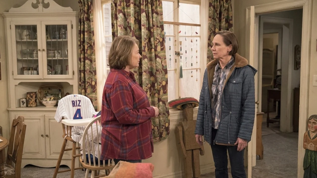 Roseanne Barr and Laurie Metcalf face each other, conversing.
