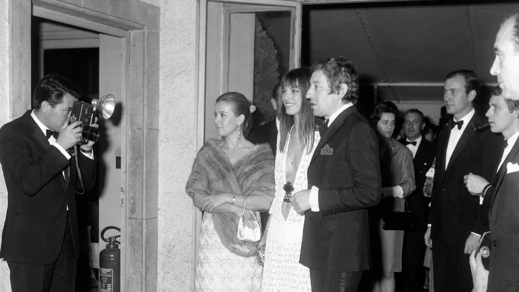 Jane Birkin wearing her iconic plunging white crochet dress at the Union of the Artists Gala in Paris in 1969