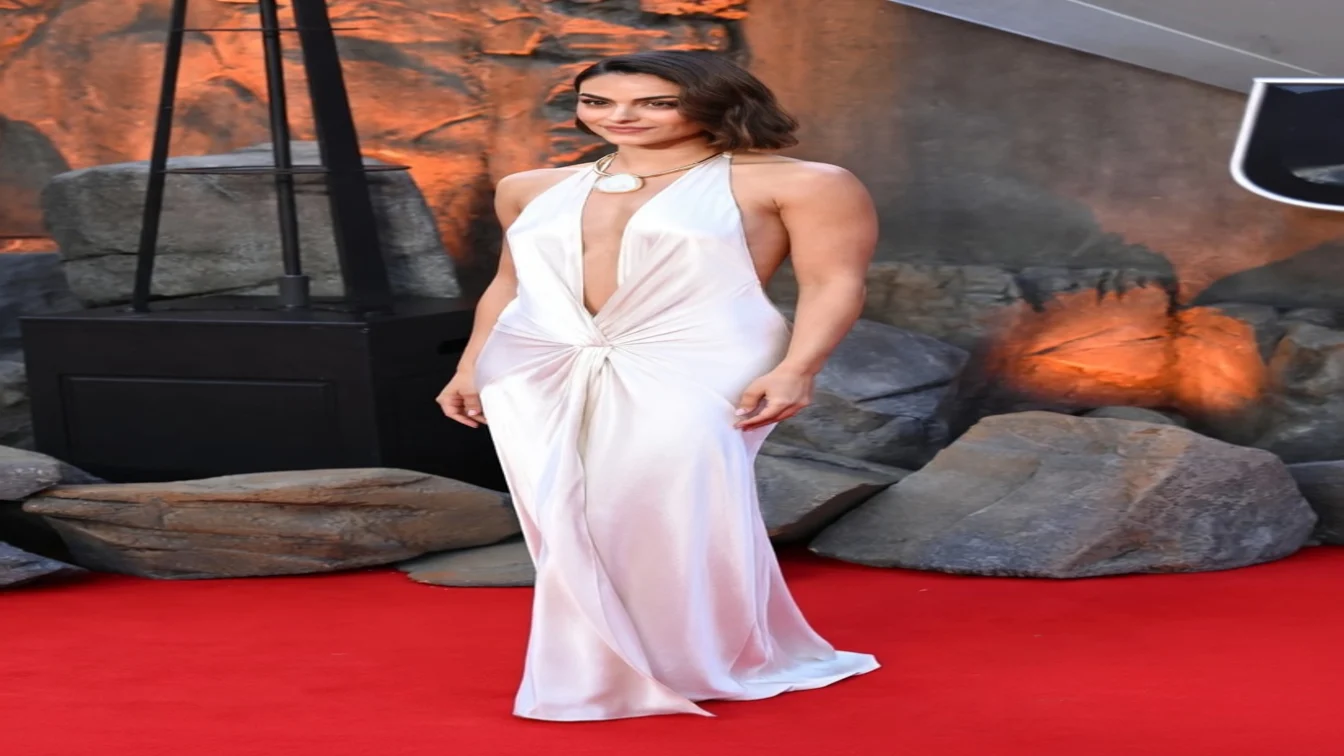 Camila Mendes wore a custom Anna October white satin halter gown to the Masters Of The Universe London premiere.