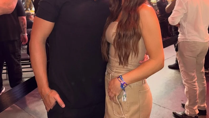 Jordan and Jessi Ngatikaura smiling at a UFC event.