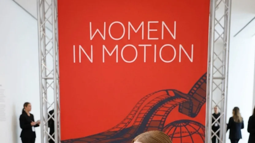 Julianne Moore sitting and facing forward at a "Women In Motion" talk.