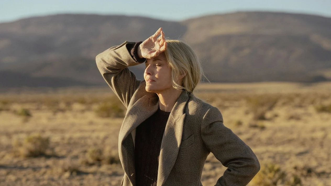 Michelle Pfeiffer as Stacy Clyburn shielding her eyes from the sun.