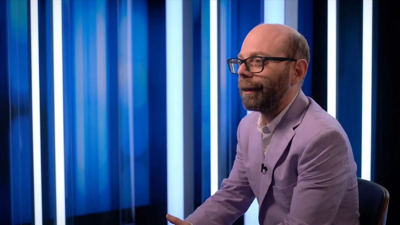 Steven Anthony Lawrence, known for playing Beans on "Even Stevens," wearing a lavender suit jacket.