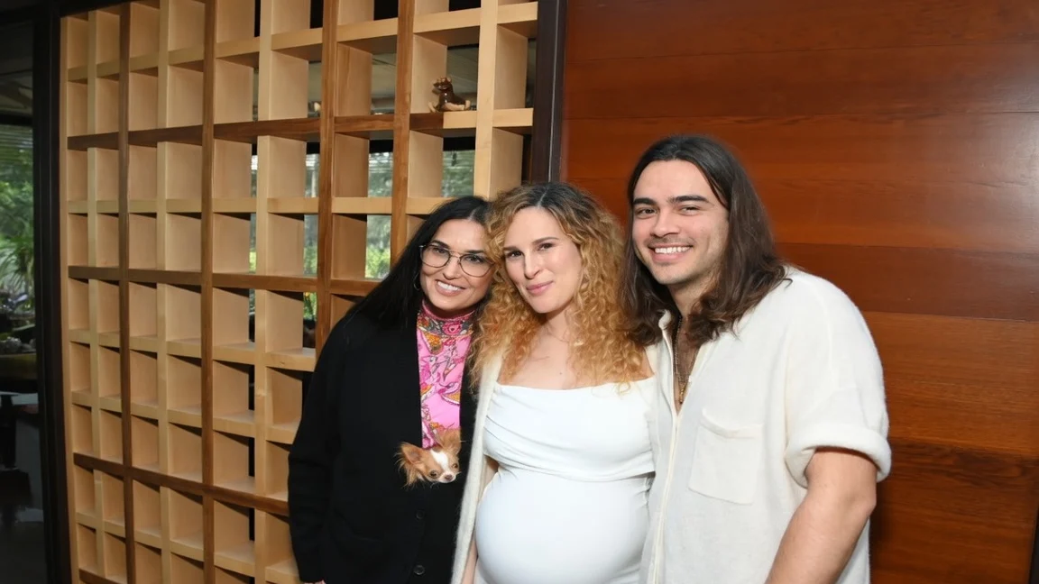 Demi Moore, Rumer Willis, and Derek Richard Thomas smiling for a baby shower.