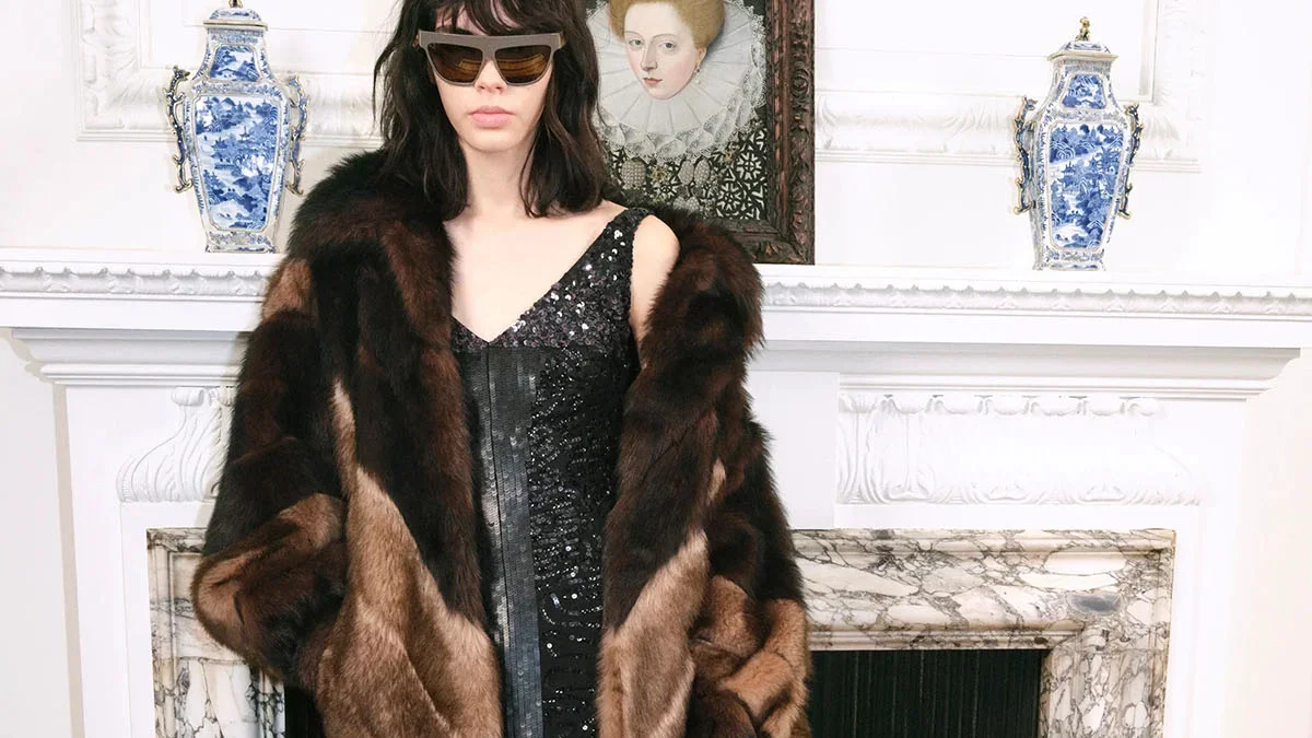 Valentino Pre-Fall 2026 faux-fur coat and feather-trimmed dress from the runway presentation