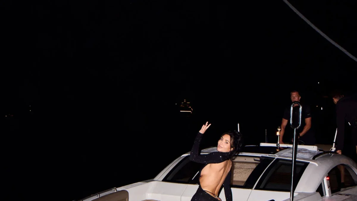 Kim Kardashian showcases the open-back detail of her Gucci Fall 2026 dress in Monaco