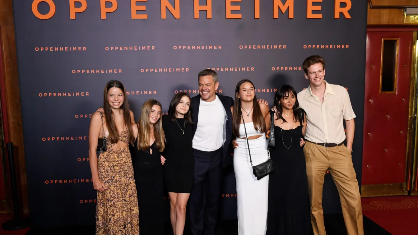 Matt Damon (C) poses with his daughters Stella Damon, Gia Damon and Alexia Barroso upon their arrival for the "Premiere" of the movie "Oppenheimer" at the Grand Rex cinema in Paris on July 11, 2023.