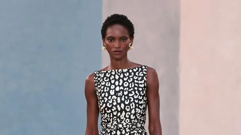 Carolina Herrera Fall 2026 leopard-print peplum top and tailored trousers on the runway.